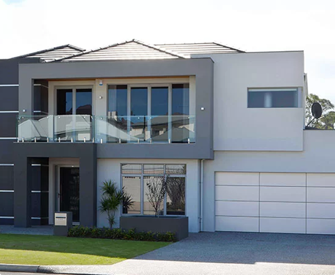 Modern home exterior with Gliderol sectional garage door and Colorbond steel finish.