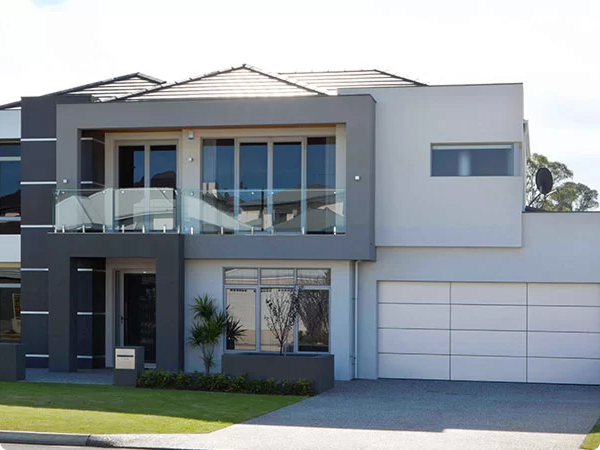 Modern home exterior with Gliderol sectional garage door and Colorbond steel finish.