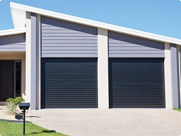 Gliderol sectional garage doors installed on a modern home in Dandenong, VIC.