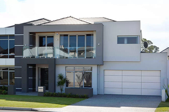 Modern home exterior with sectional overhead Gliderol garage door and Colorbond finish.